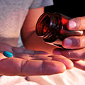Image of blue pill in hand. Photo Credit: Copyright: nito500 / 123RF Stock Photo